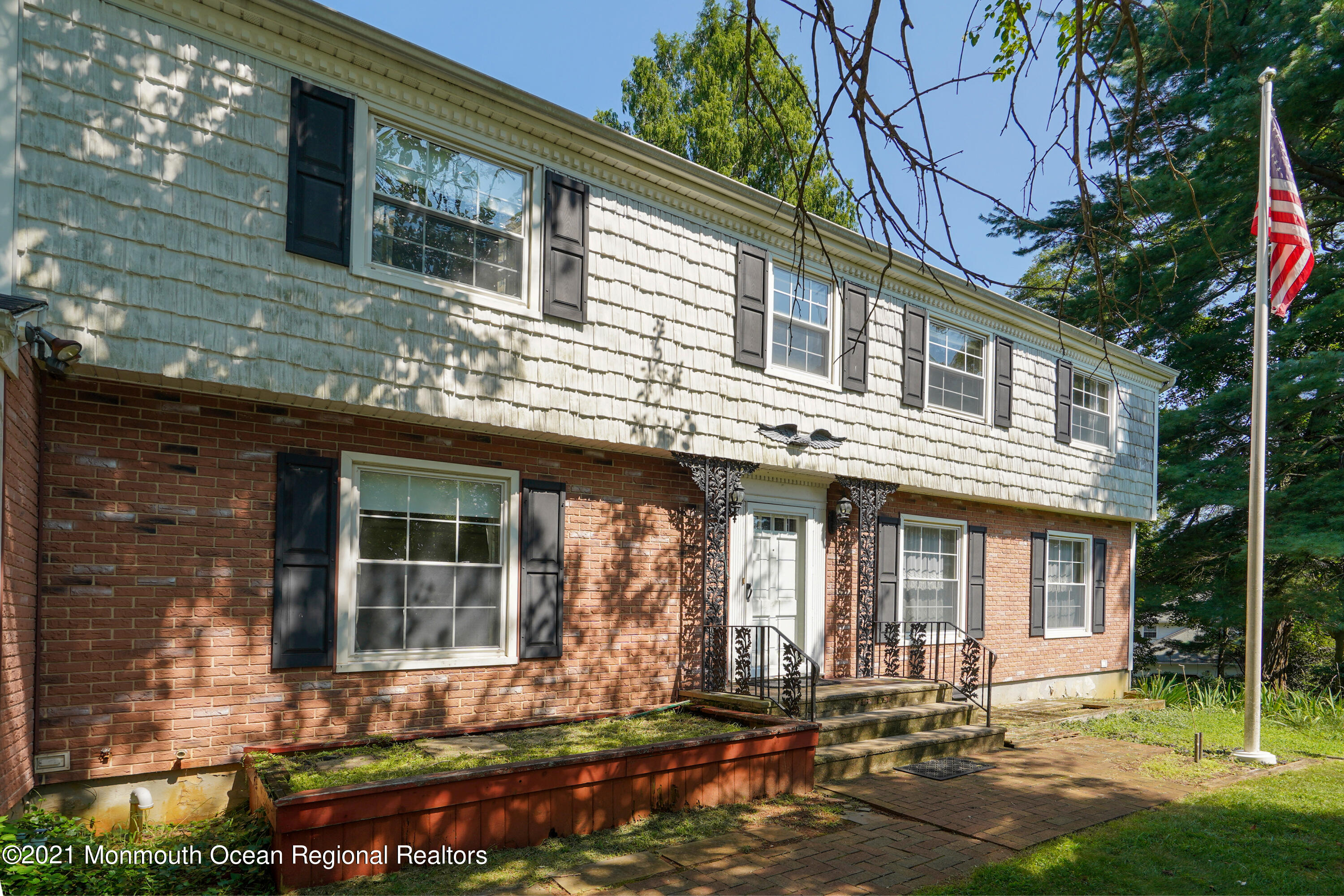 32 Beaver Dam Road Colts Neck, NJ 07722 - Photo 2 of 27 a front view of a house with a yard