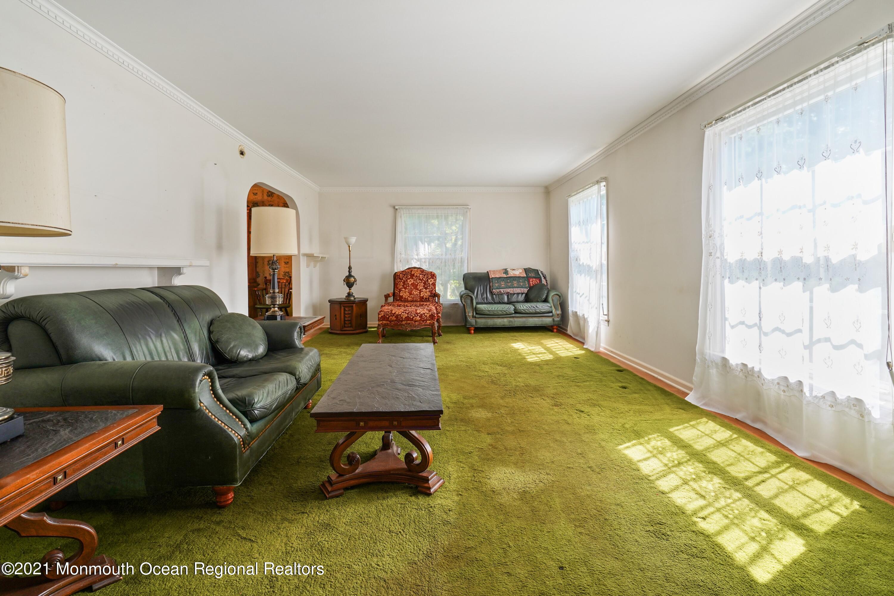 32 Beaver Dam Road Colts Neck, NJ 07722 - Photo 11 of 27 a living room with furniture and a large window
