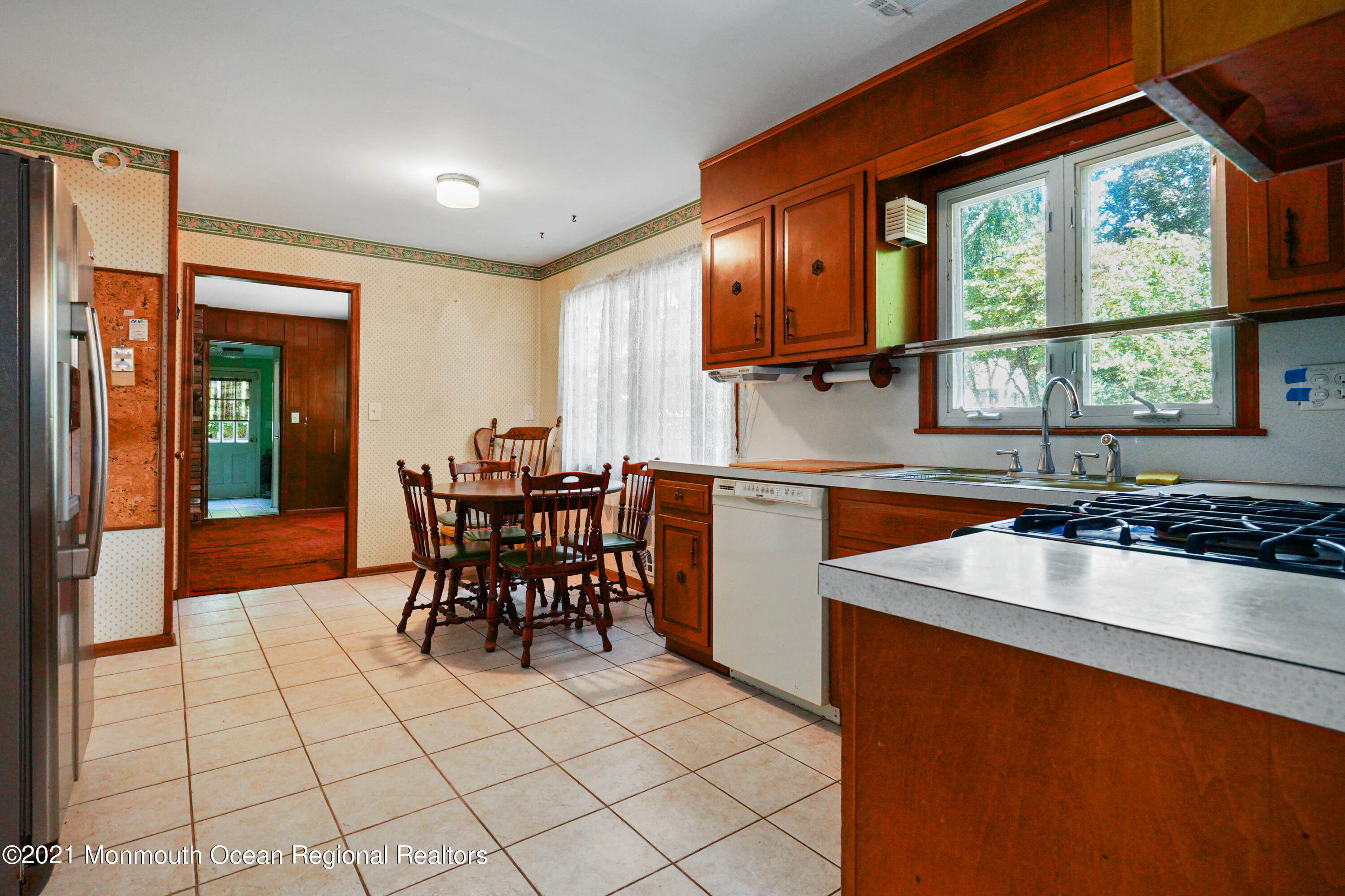 32 Beaver Dam Road Colts Neck, NJ 07722 - Photo 15 of 27 a kitchen with a sink and chairs