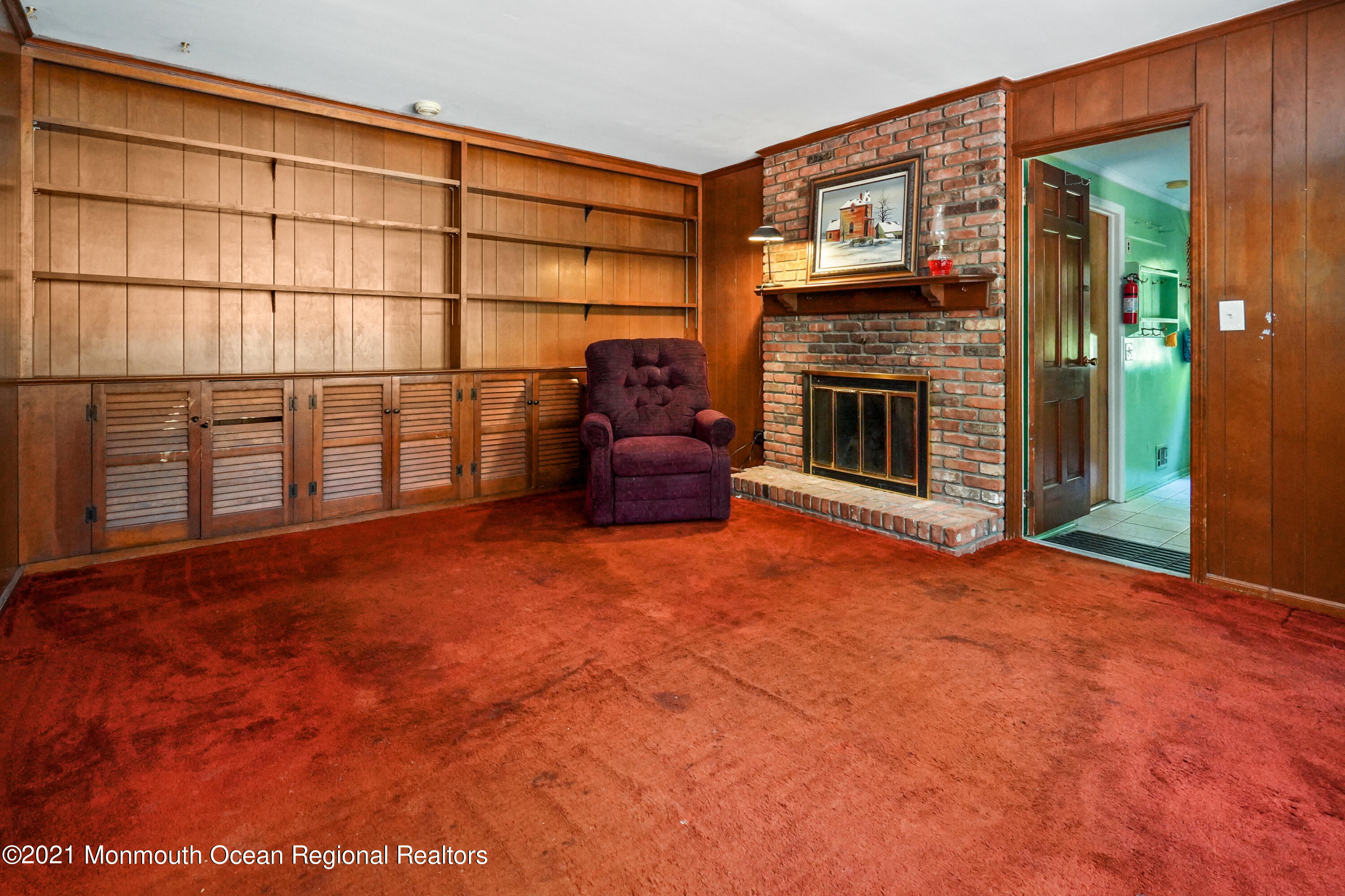 32 Beaver Dam Road Colts Neck, NJ 07722 - Photo 17 of 27 a view of an empty room with a fireplace