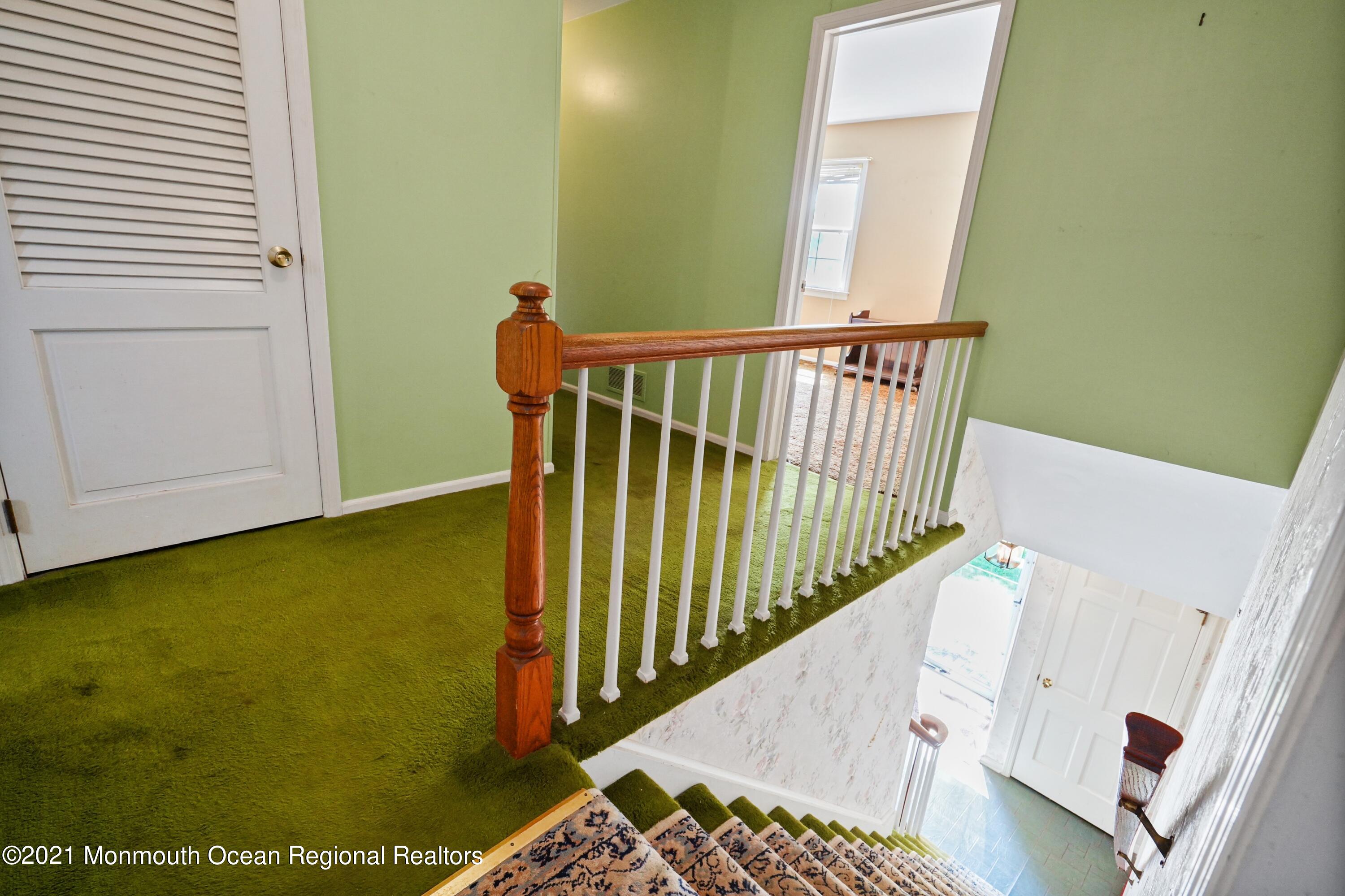 32 Beaver Dam Road Colts Neck, NJ 07722 - Photo 19 of 27 a view of balcony with wooden floor