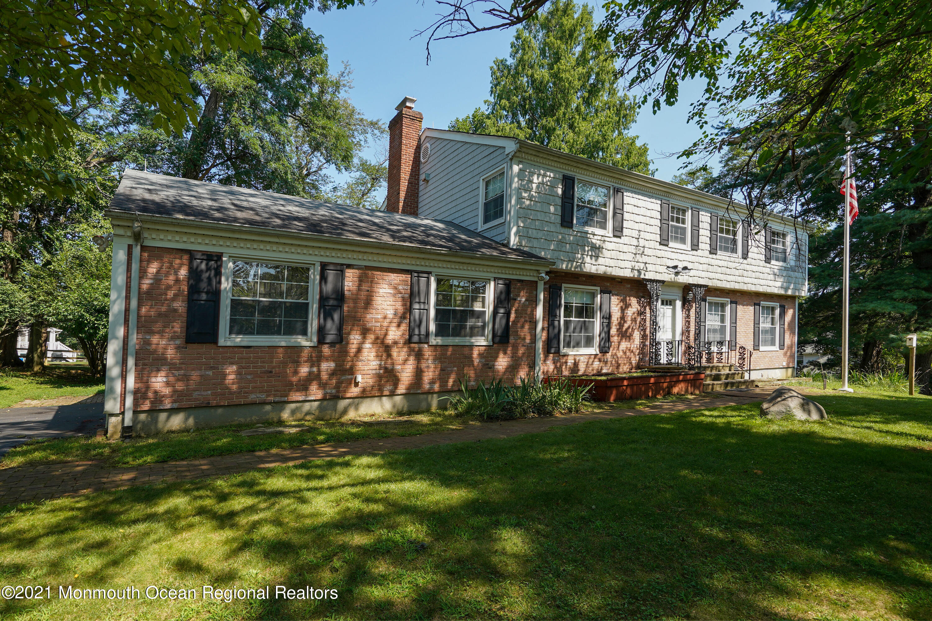 32 Beaver Dam Road Colts Neck, NJ 07722 - Photo 3 of 27 front view of a house with a yard