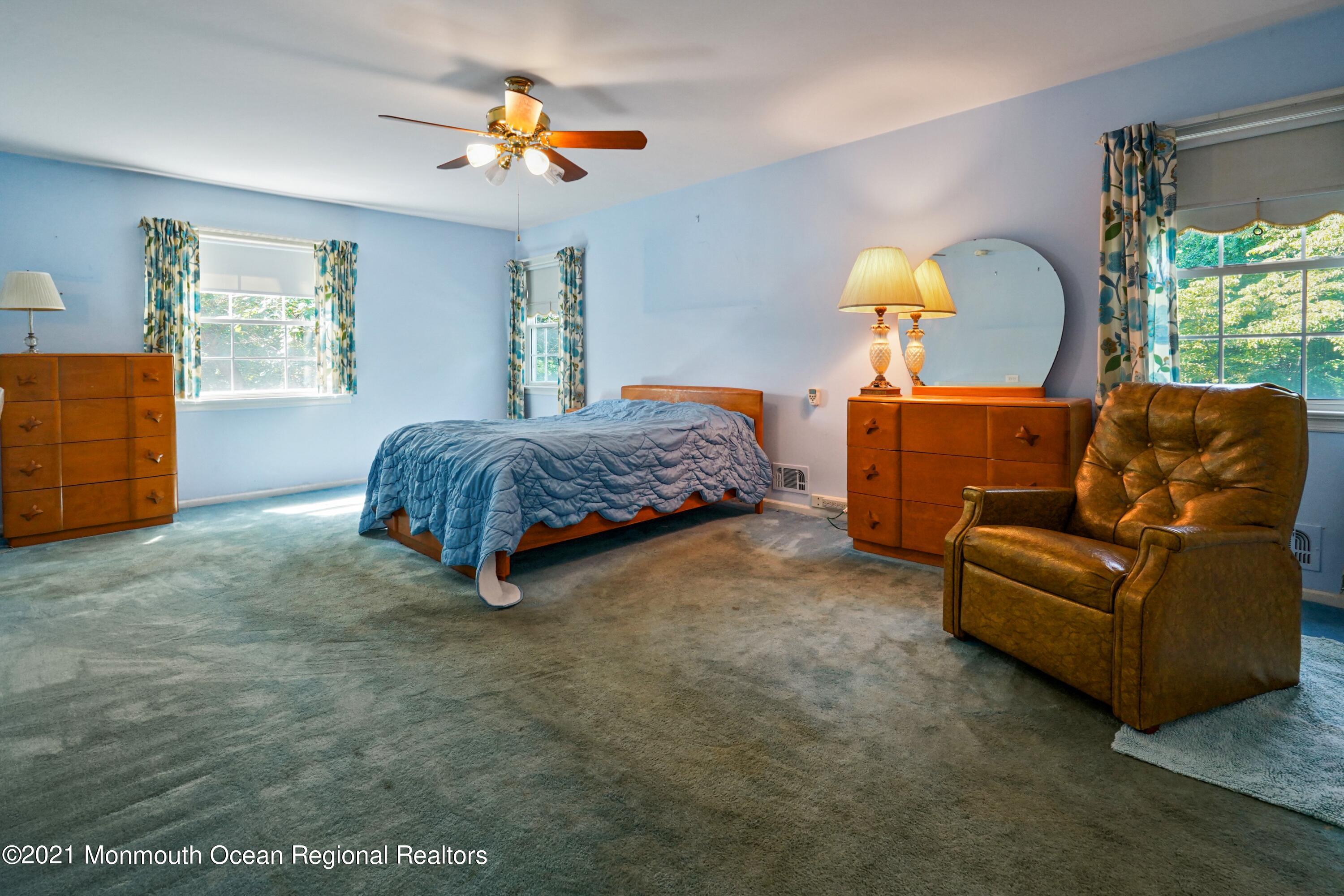 32 Beaver Dam Road Colts Neck, NJ 07722 - Photo 21 of 27 a living room with a bed furniture and a window