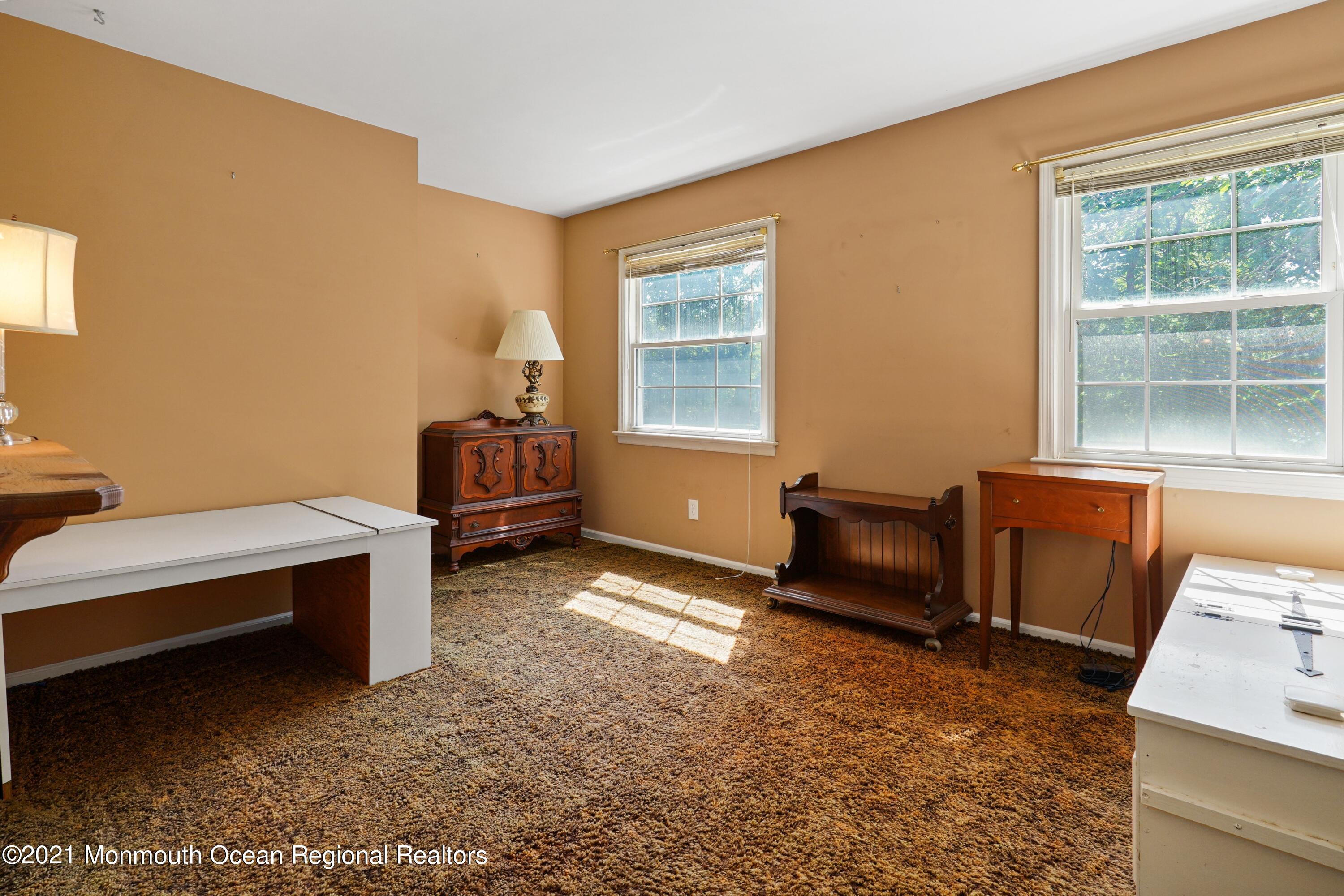 32 Beaver Dam Road Colts Neck, NJ 07722 - Photo 24 of 27 a bedroom with furniture and a window