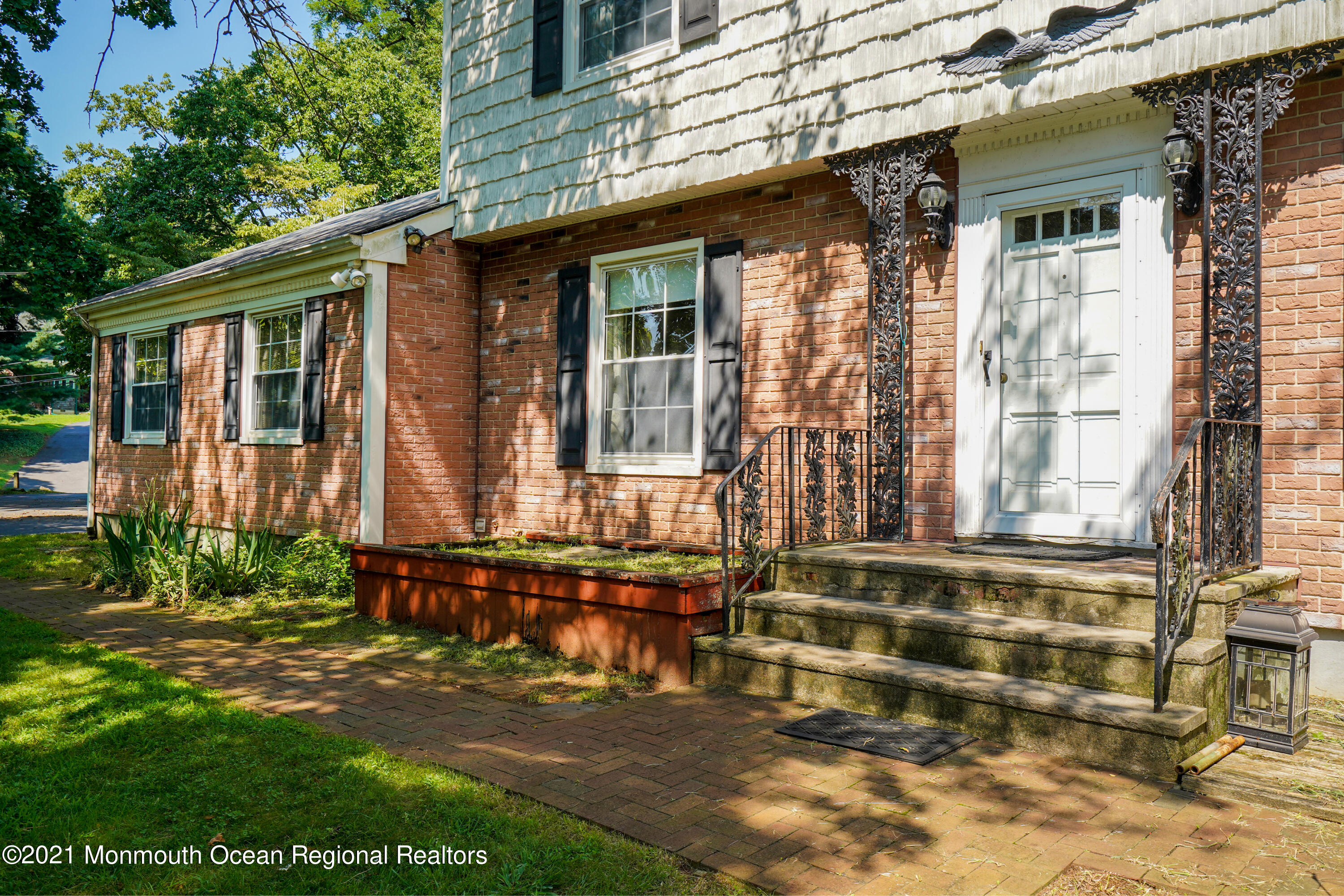 32 Beaver Dam Road Colts Neck, NJ 07722 - Photo 4 of 27 a front view of a house with a yard