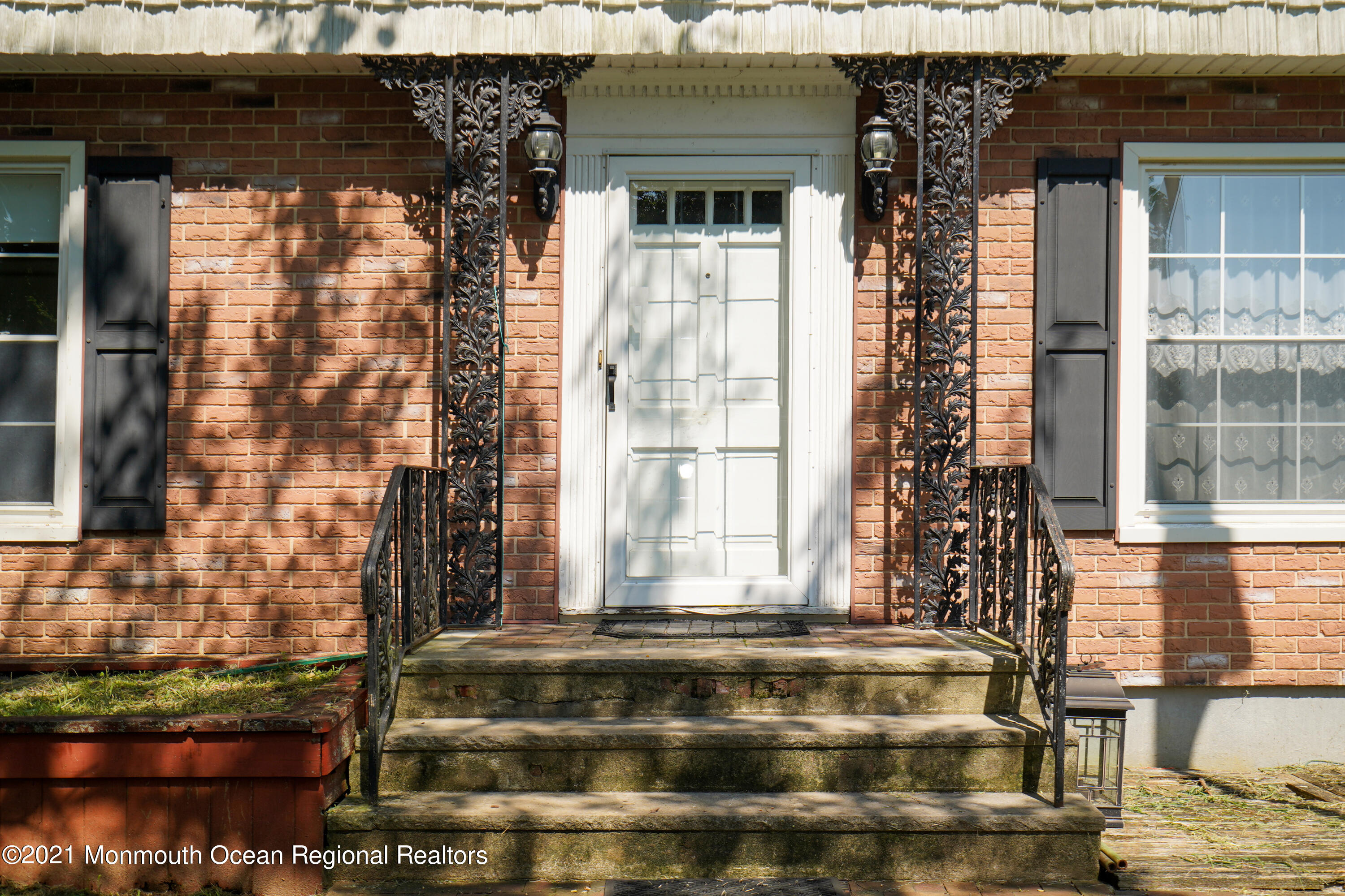 32 Beaver Dam Road Colts Neck, NJ 07722 - Photo 5 of 27 a front view of a house with a garden