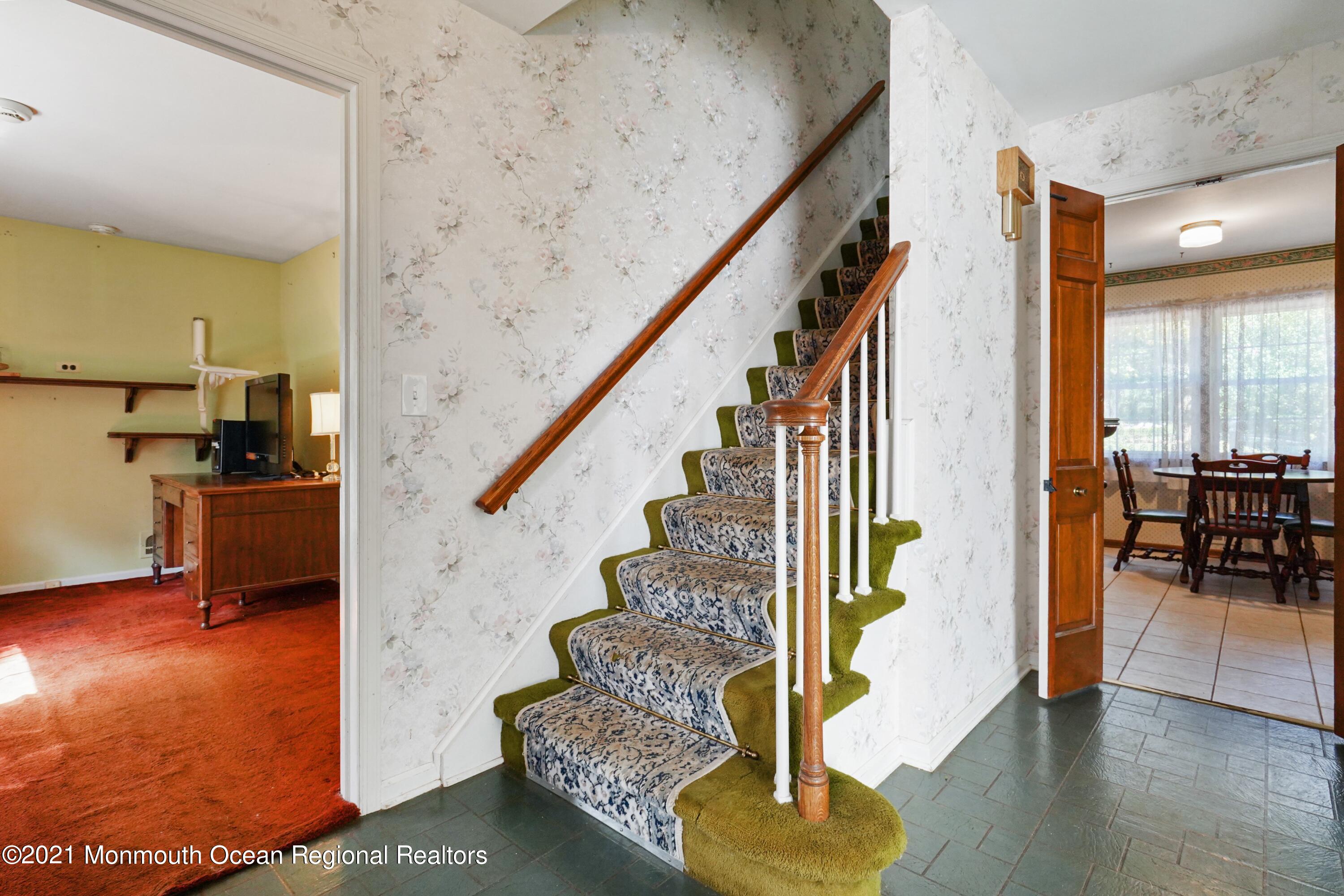 32 Beaver Dam Road Colts Neck, NJ 07722 - Photo 8 of 27 a view of entryway and hall with wooden floor