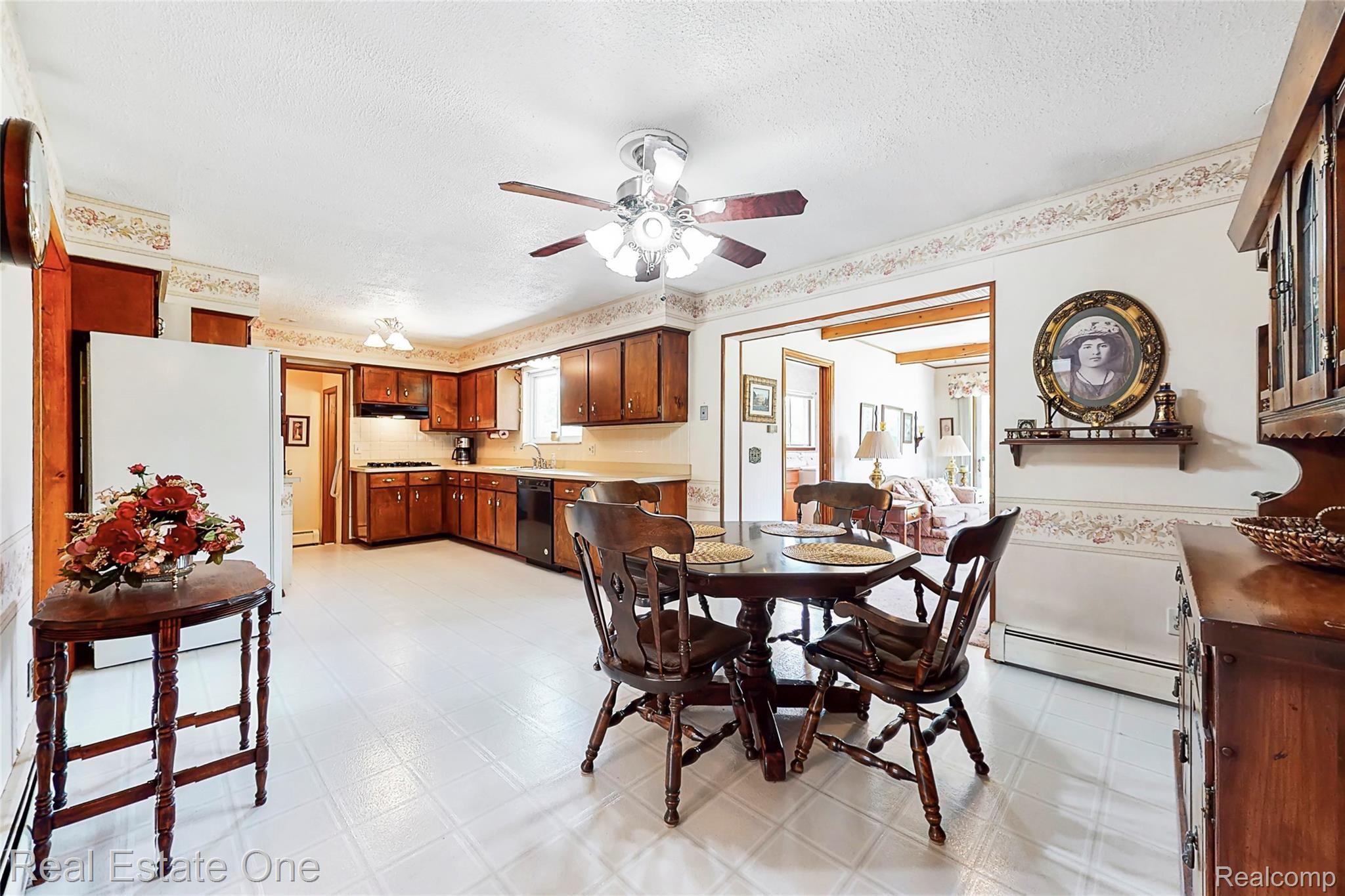 5360 Greenfield Road Brighton, MI 48114 - Photo 17 of 44 Large open kitchen sits in the center of the home.
