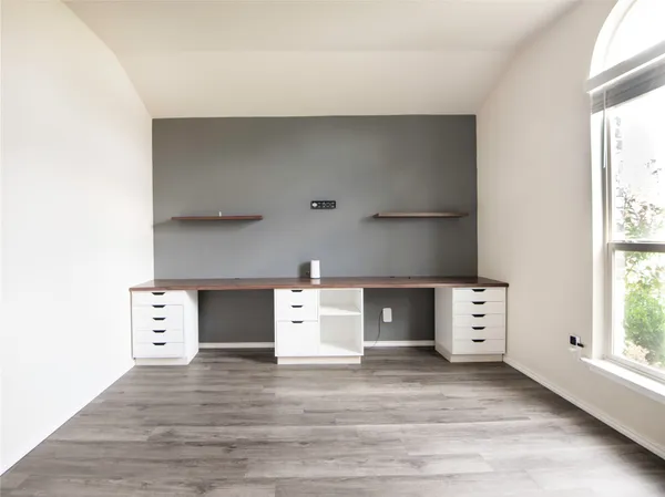 a view of a kitchen with furniture and window