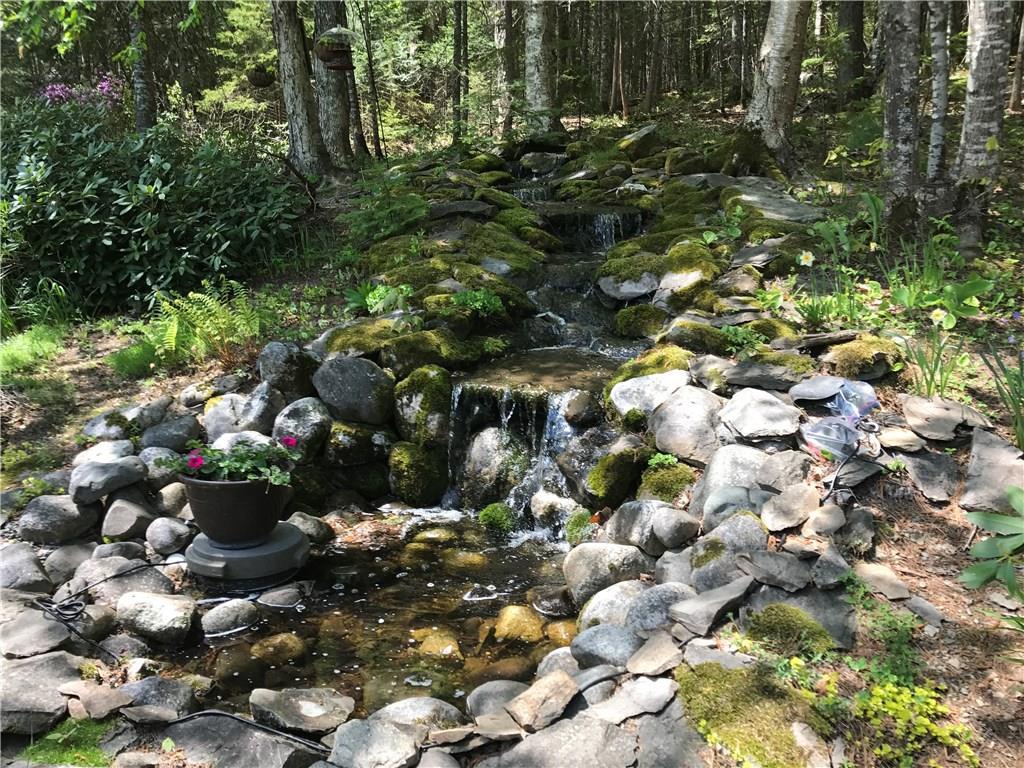 297 Shore Road Dexter, ME 04930 - Photo 23 of 35 Views of manmade waterfall from...