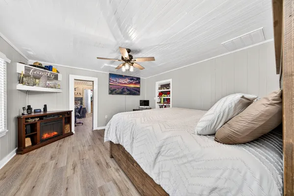 a living room with lots of furniture and a chandelier