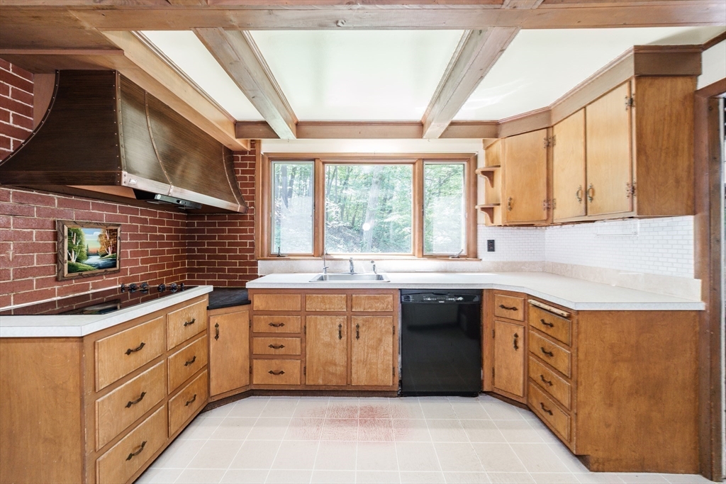 6 Megonko Road Natick, MA 01760 - Photo 14 of 40 a kitchen with stainless steel appliances granite countertop a stove a sink and a microwave