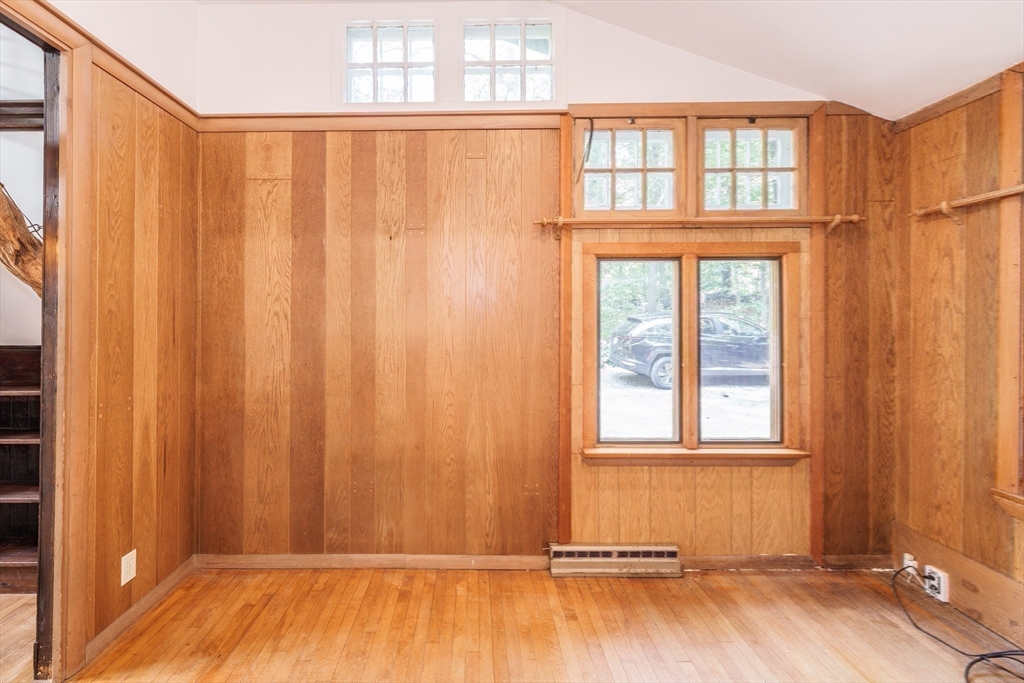 6 Megonko Road Natick, MA 01760 - Photo 16 of 40 a view of a room with wooden floor and windows