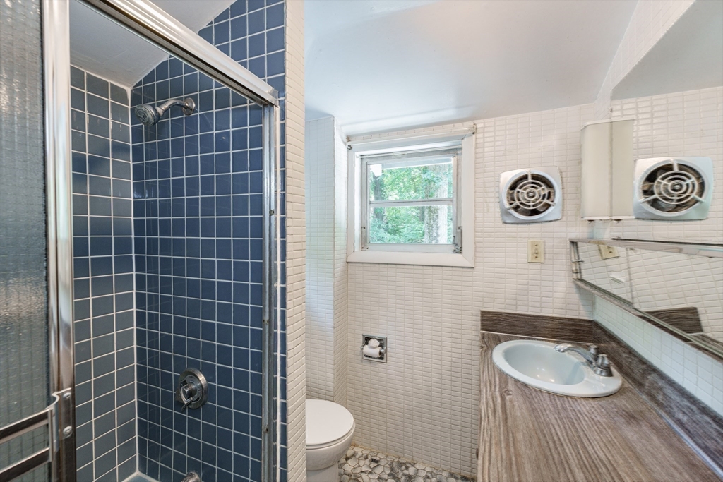 6 Megonko Road Natick, MA 01760 - Photo 24 of 40 a bathroom with a toilet a sink and a shower