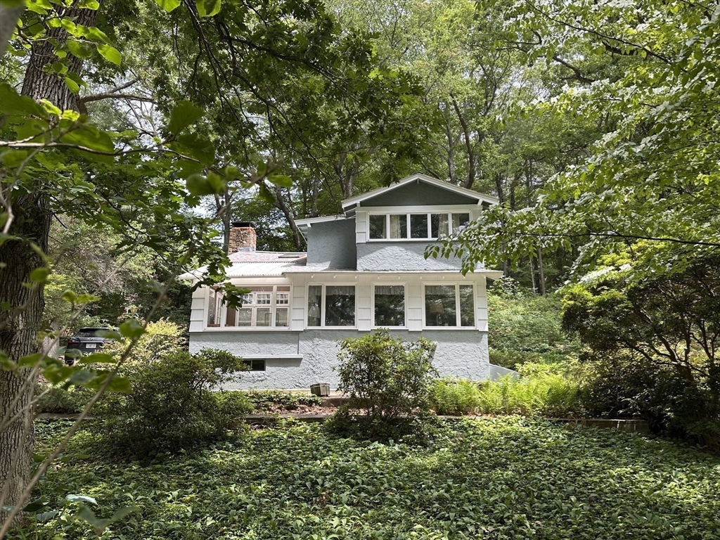 6 Megonko Road Natick, MA 01760 - Photo 3 of 40 a front view of a house with a yard and trees