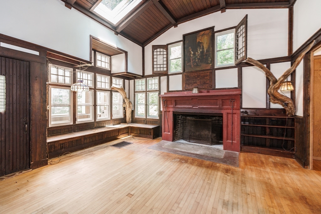 6 Megonko Road Natick, MA 01760 - Photo 7 of 40 a view of an empty room with a fireplace and a window