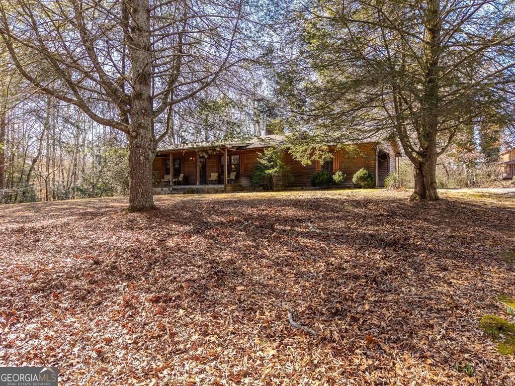2164 Yukon Road Ellijay, GA 30536 - Photo 2 of 43 a view of a backyard with large trees
