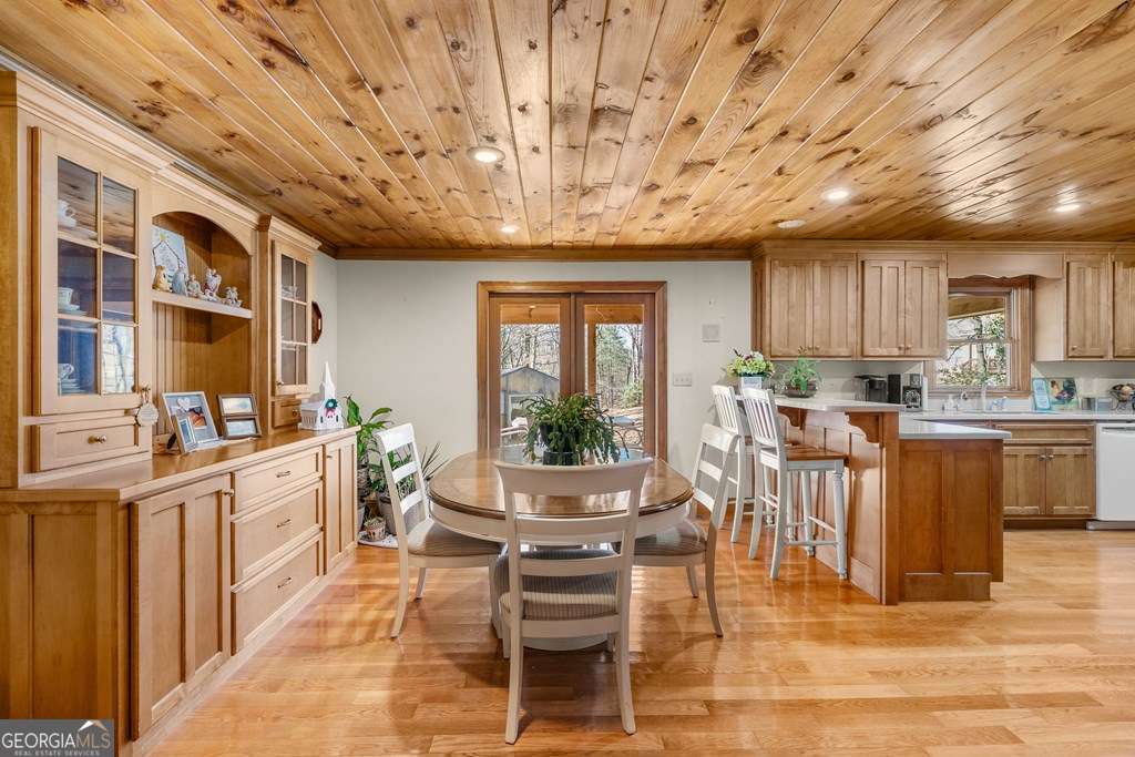 2164 Yukon Road Ellijay, GA 30536 - Photo 24 of 43 a kitchen with stainless steel appliances granite countertop a stove cabinets and wooden floor