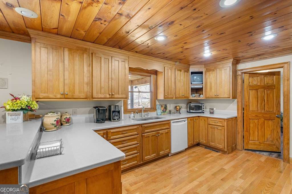 2164 Yukon Road Ellijay, GA 30536 - Photo 29 of 43 a kitchen with lots of counter top space and wooden floor