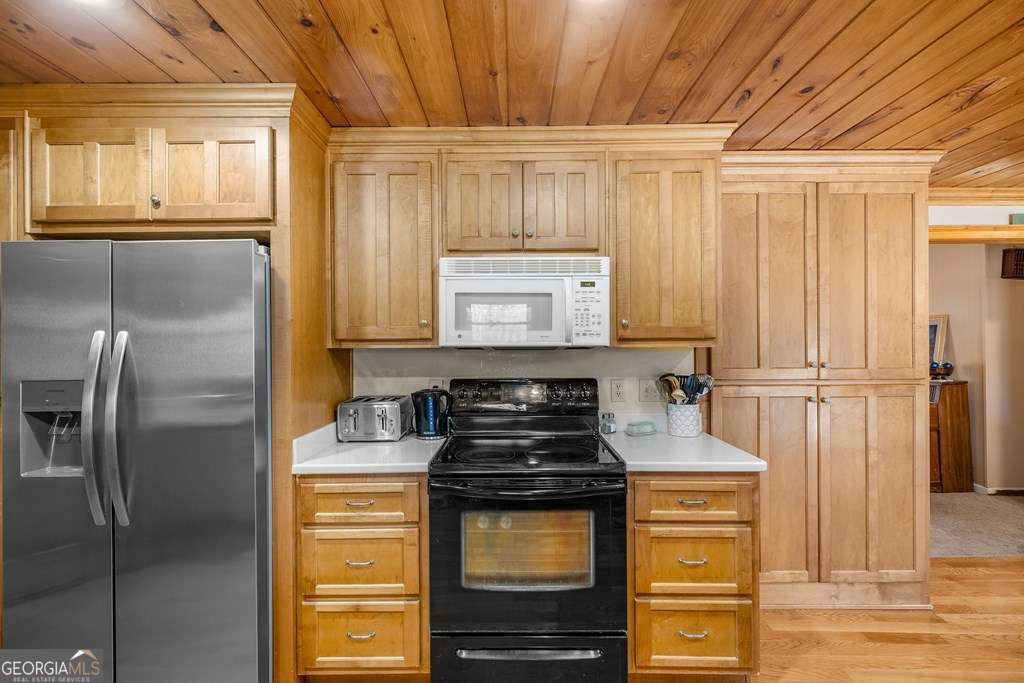 2164 Yukon Road Ellijay, GA 30536 - Photo 30 of 43 a kitchen with a stove and a refrigerator