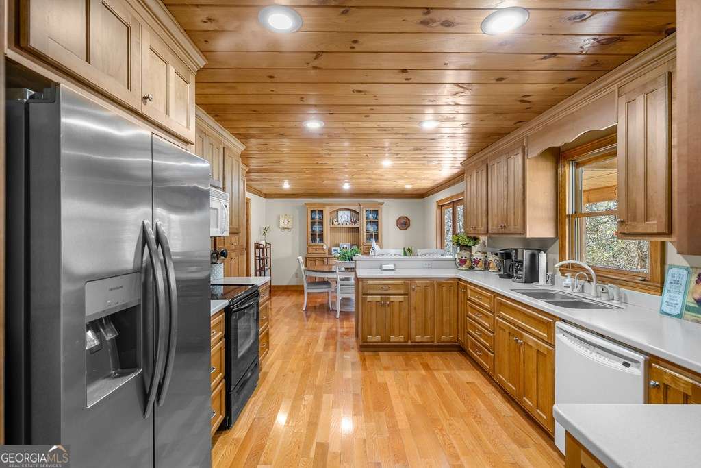 2164 Yukon Road Ellijay, GA 30536 - Photo 31 of 43 a kitchen with lots of counter top space and stainless steel appliances