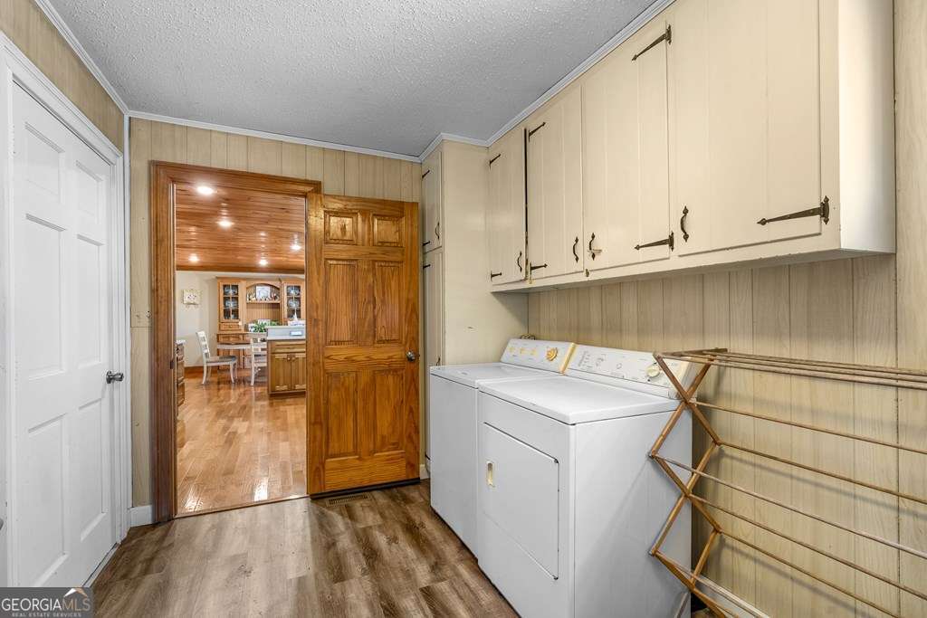 2164 Yukon Road Ellijay, GA 30536 - Photo 32 of 43 a utility room with cabinets washer and dryer