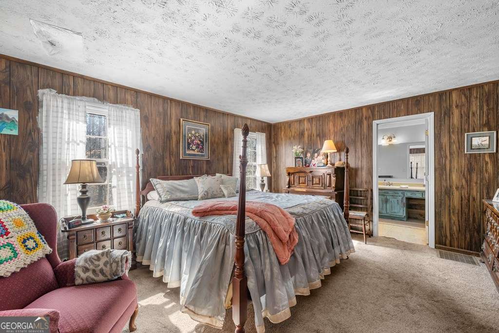 2164 Yukon Road Ellijay, GA 30536 - Photo 33 of 43 a bedroom with a bed and a view kitchen