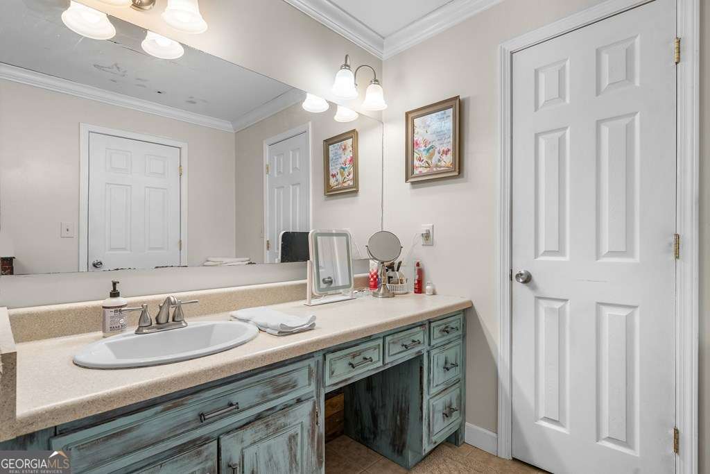 2164 Yukon Road Ellijay, GA 30536 - Photo 37 of 43 a bathroom with double vanity sinks and a mirror