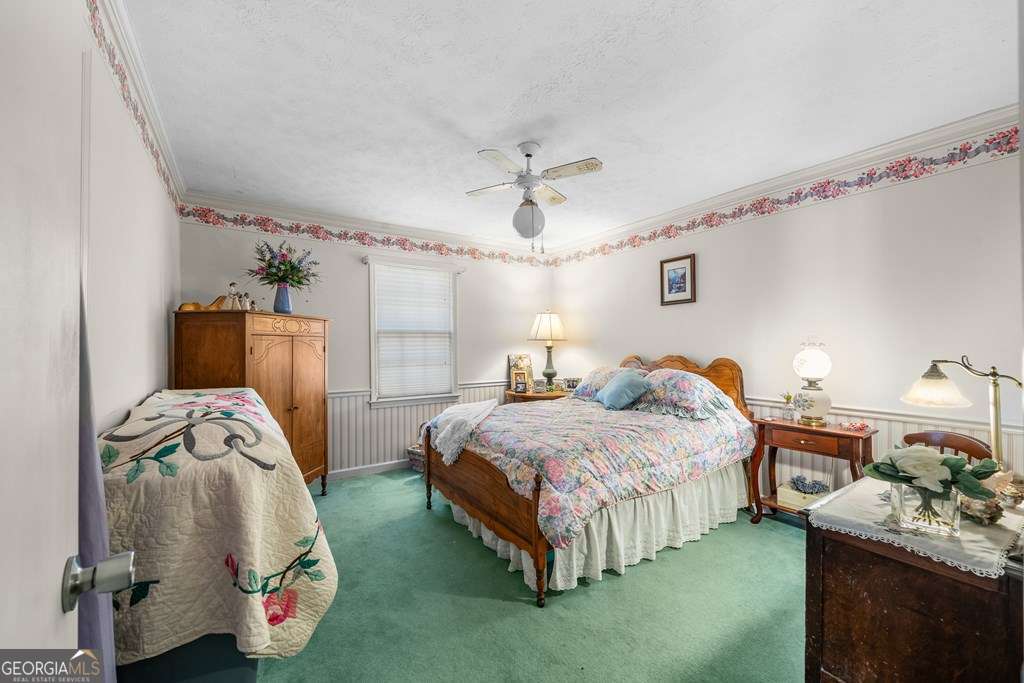 2164 Yukon Road Ellijay, GA 30536 - Photo 38 of 43 a bedroom with bed and a window