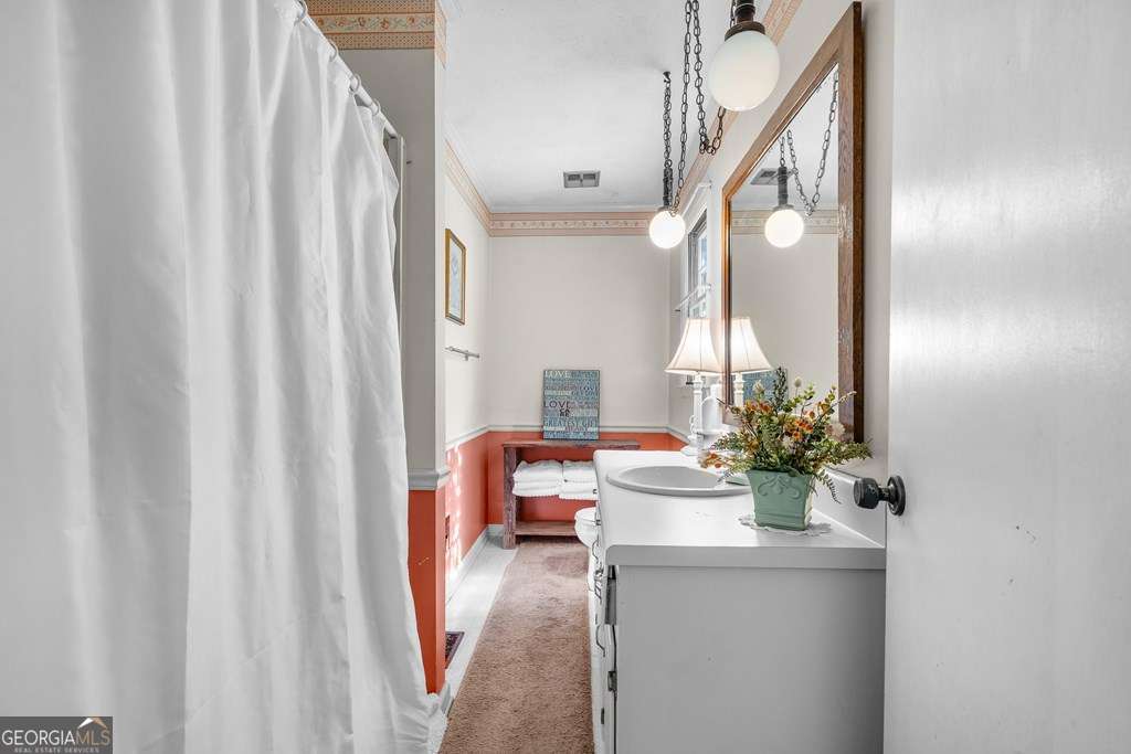 2164 Yukon Road Ellijay, GA 30536 - Photo 39 of 43 a living room with furniture and a chandelier