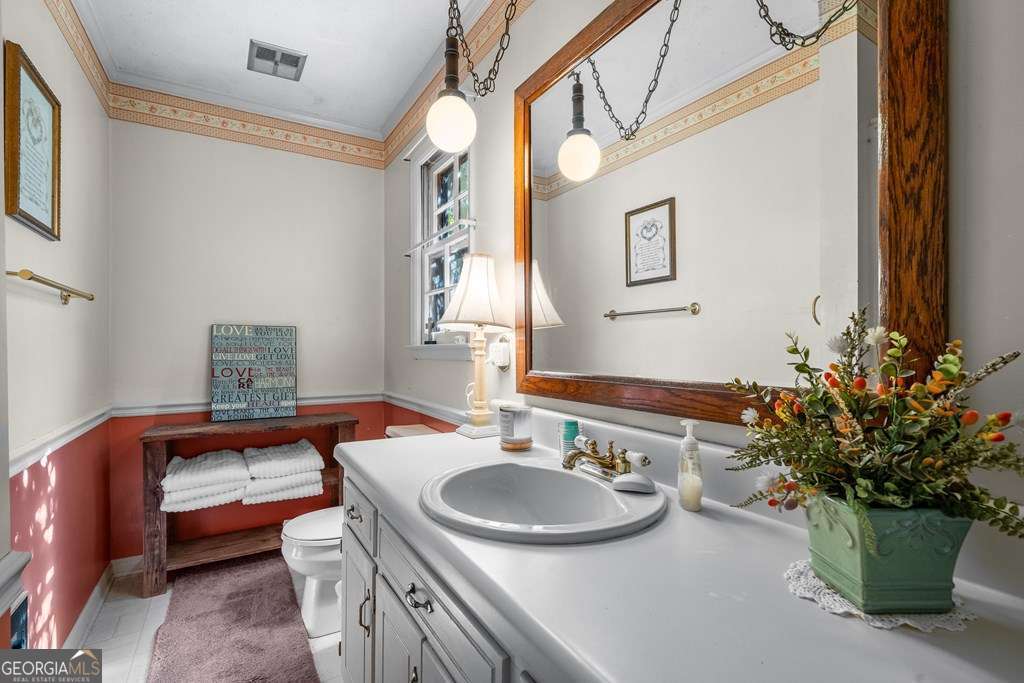 2164 Yukon Road Ellijay, GA 30536 - Photo 40 of 43 a bathroom with a sink and a mirror