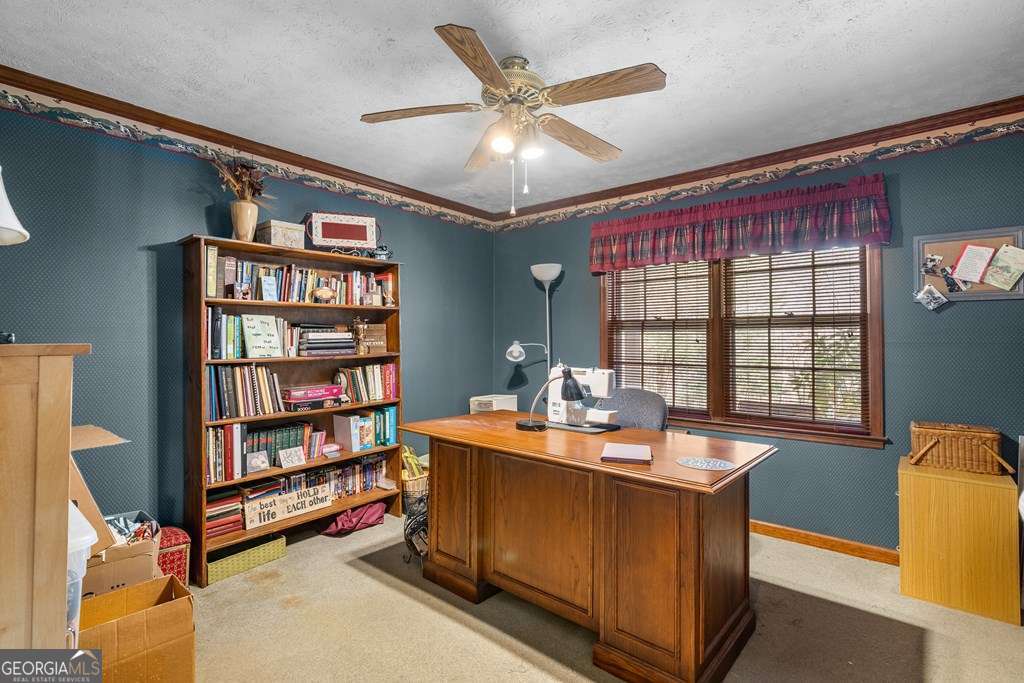 2164 Yukon Road Ellijay, GA 30536 - Photo 41 of 43 a room with a bookshelf bed and a window