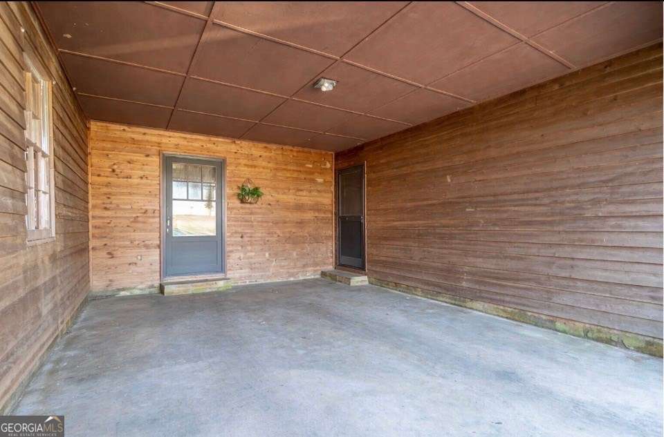 2164 Yukon Road Ellijay, GA 30536 - Photo 42 of 43 a view of an empty room with brick wall and a window
