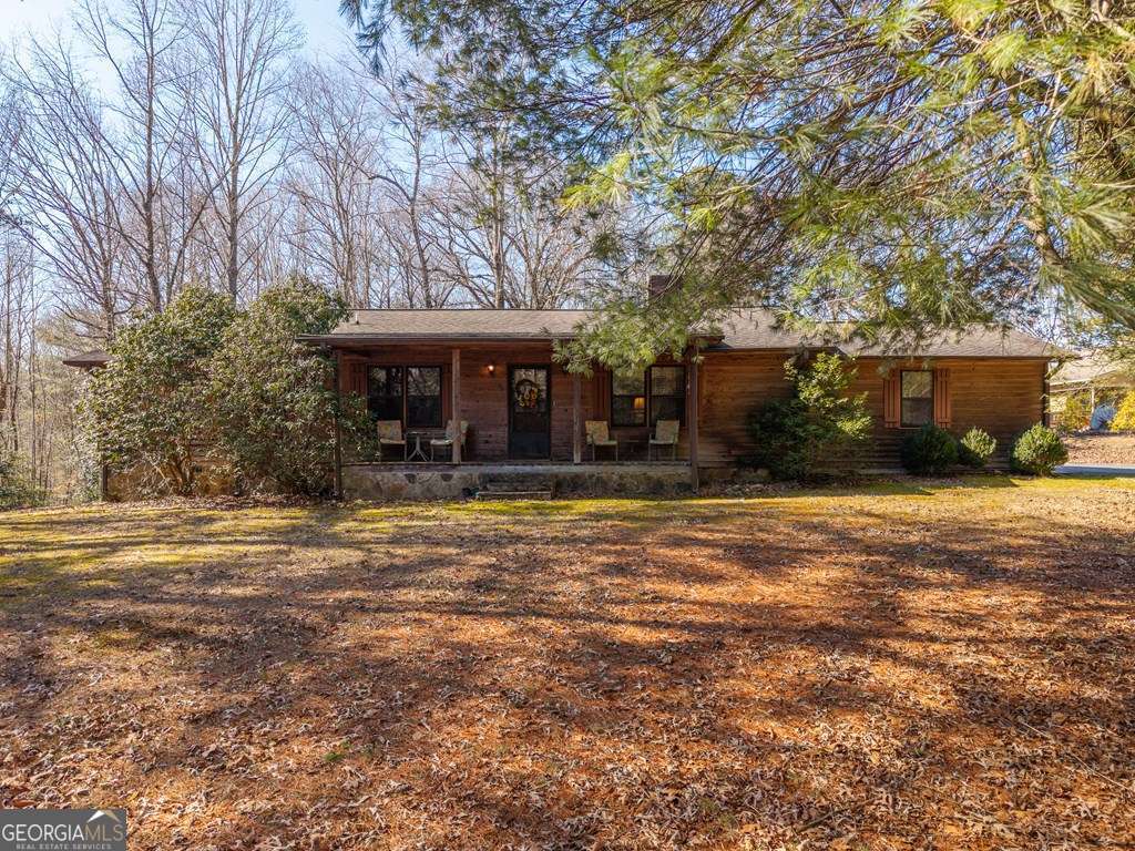 2164 Yukon Road Ellijay, GA 30536 - Photo 5 of 43 a front view of a house with a yard and trees