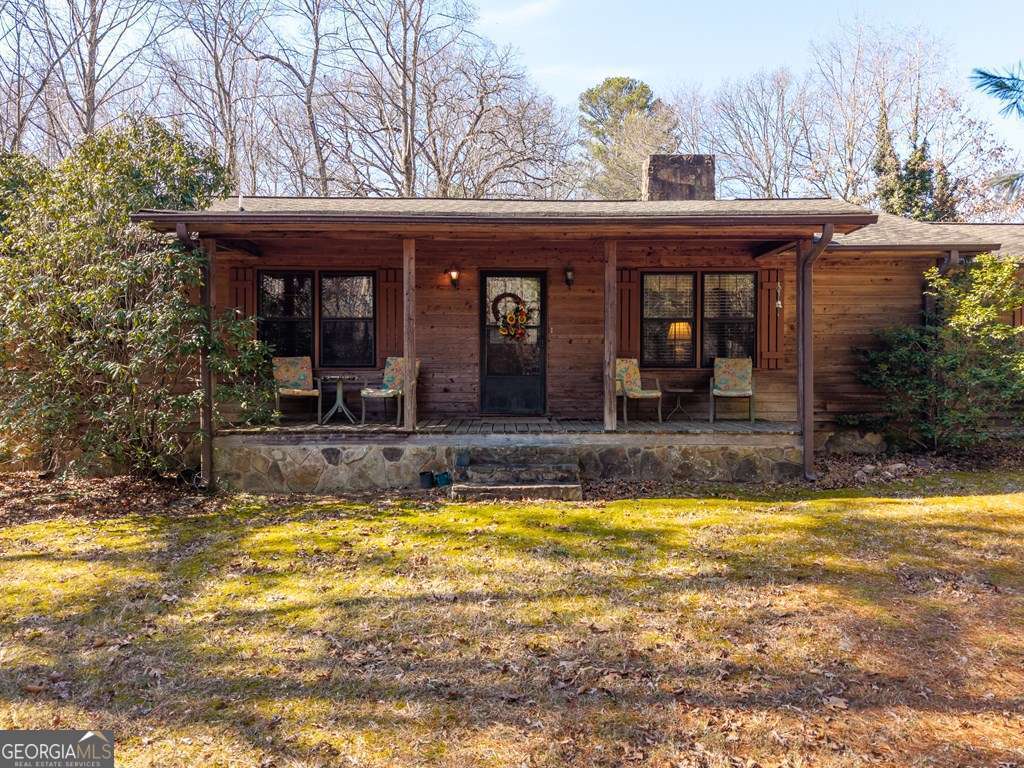 2164 Yukon Road Ellijay, GA 30536 - Photo 6 of 43 a view of a swimming pool with an outdoor seating