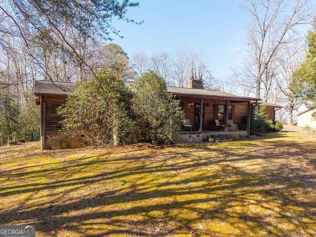2164 Yukon Road Ellijay, GA 30536 - Photo 8 of 43 a view of a house with a yard and tree s