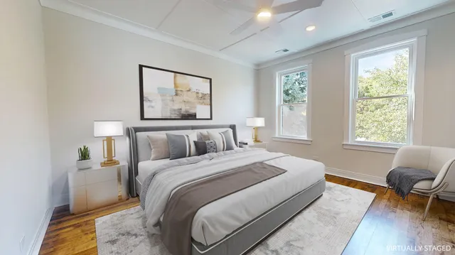 a bedroom with bed chair and window