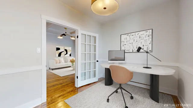 a workspace with furniture and wooden floor