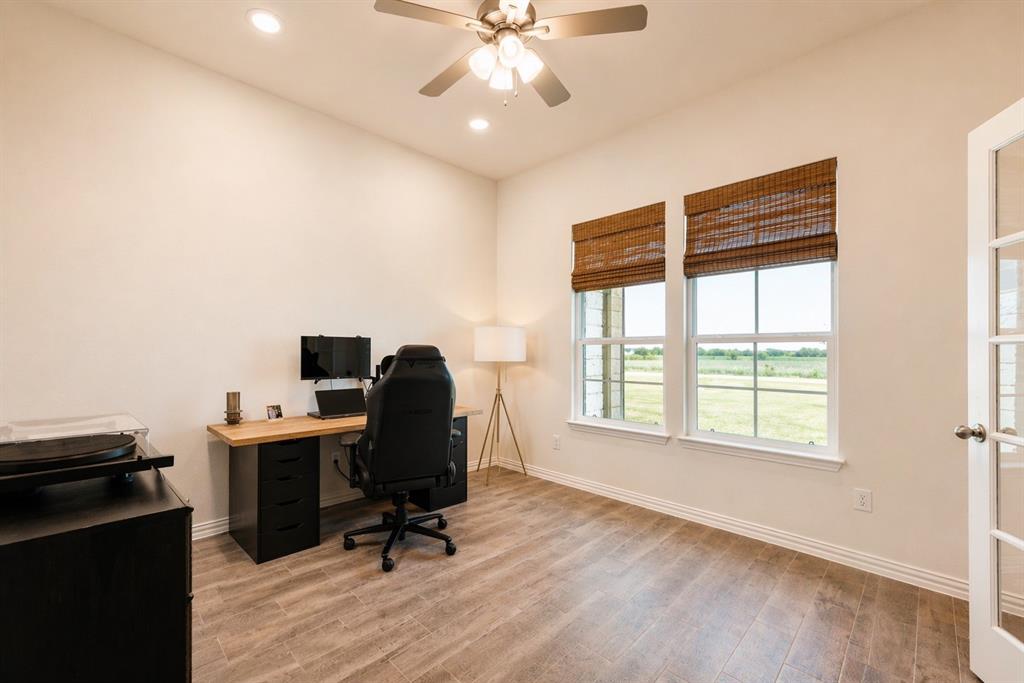 1530 County Road 200 Valley View, TX 76272 - Photo 16 of 34 Room featuring wood-finish flooring, two large windows, recessed lighting, a ceiling fan, and French doors