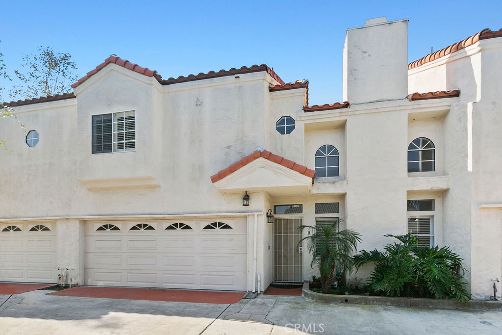 2575 Elden Avenue, Unit 2 Costa Mesa, CA 92627 - Photo 12 of 12 a front view of a house with a yard
