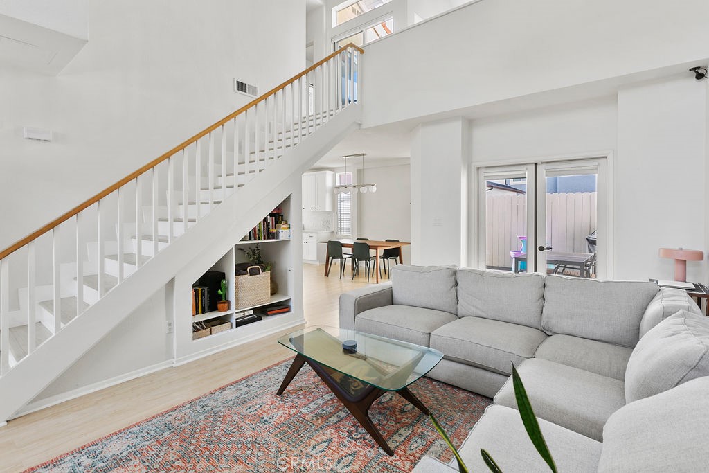 2575 Elden Avenue, Unit 2 Costa Mesa, CA 92627 - Photo 2 of 12 a living room with furniture or stairs and a couch
