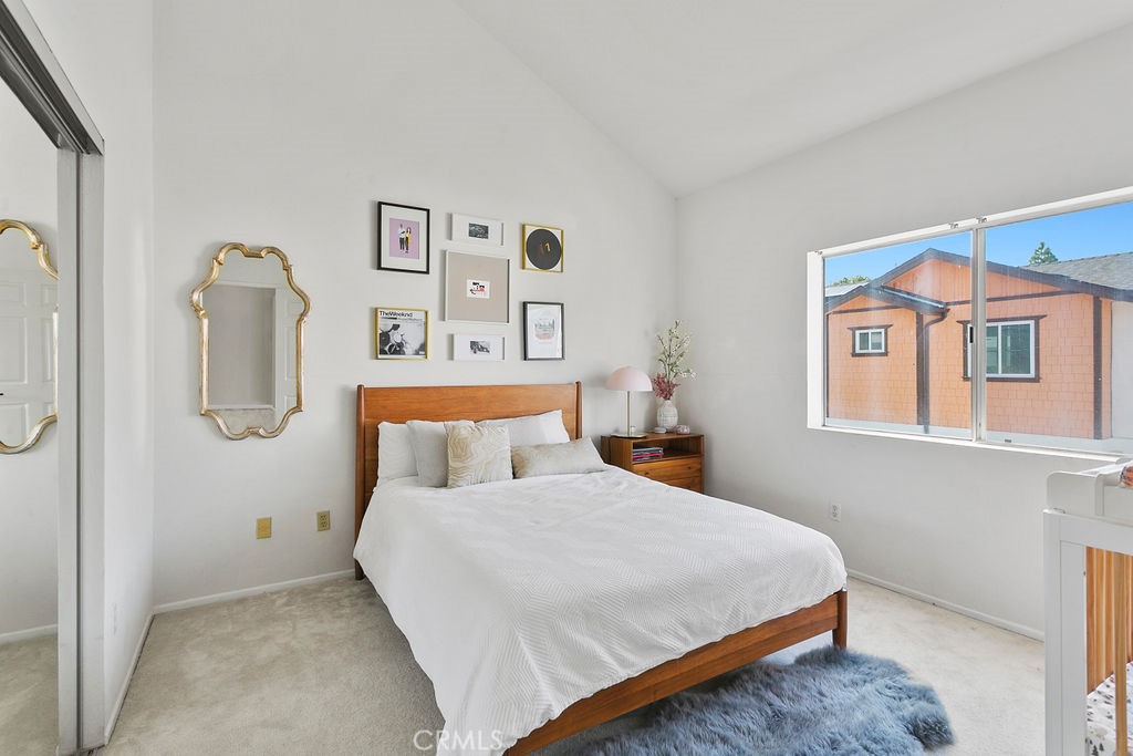 2575 Elden Avenue, Unit 2 Costa Mesa, CA 92627 - Photo 5 of 12 a bedroom with a bed and painting on the wall