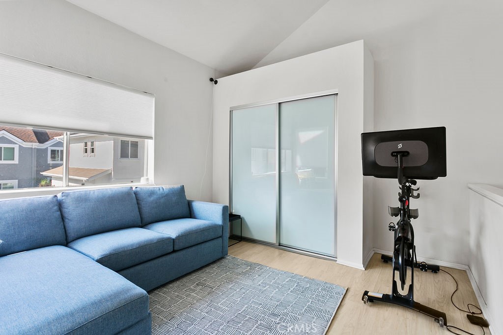 2575 Elden Avenue, Unit 2 Costa Mesa, CA 92627 - Photo 9 of 12 a living room with furniture and a wooden floor