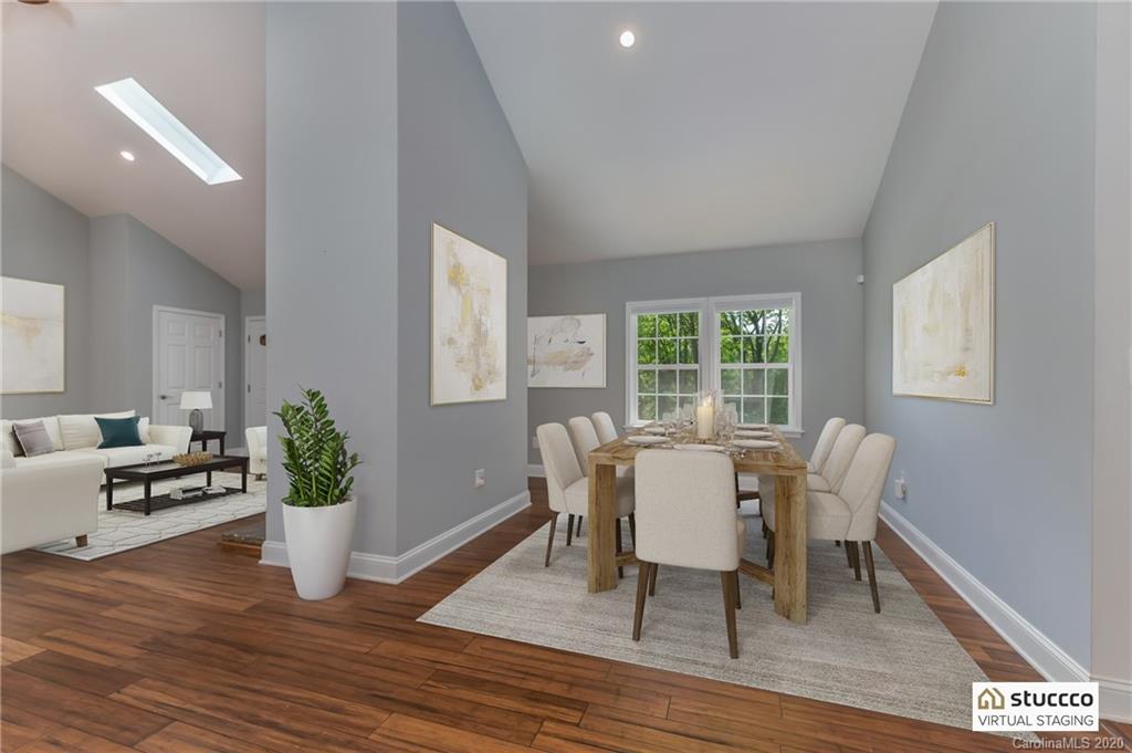 603 Vineyard Road Tryon, NC 28782 - Photo 13 of 39 a dining room with furniture potted plants and wooden floor