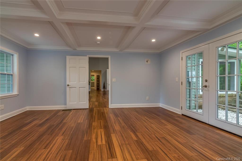 603 Vineyard Road Tryon, NC 28782 - Photo 14 of 39 a view of an empty room with wooden floor and a window