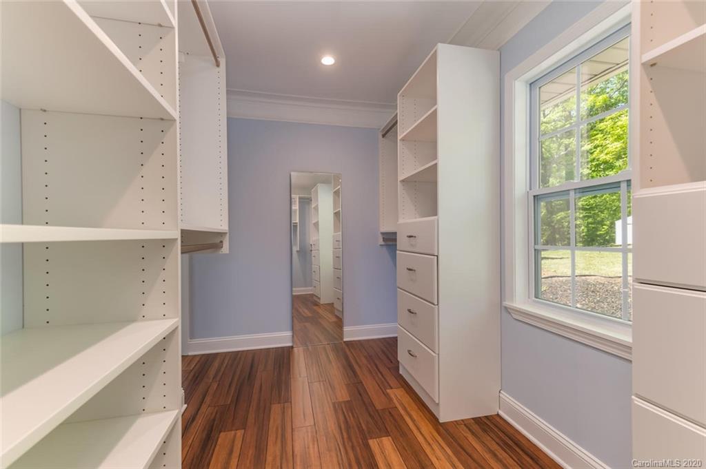 603 Vineyard Road Tryon, NC 28782 - Photo 21 of 39 a view of hallway with a large window and wooden floor