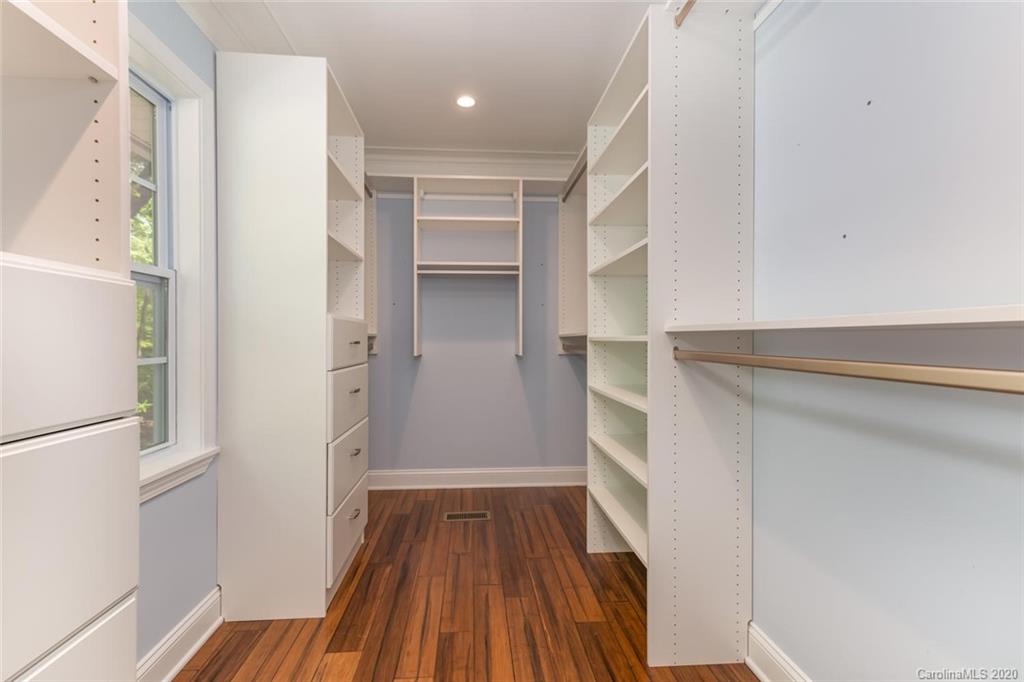 603 Vineyard Road Tryon, NC 28782 - Photo 22 of 39 a view of walk in closet with wooden floor