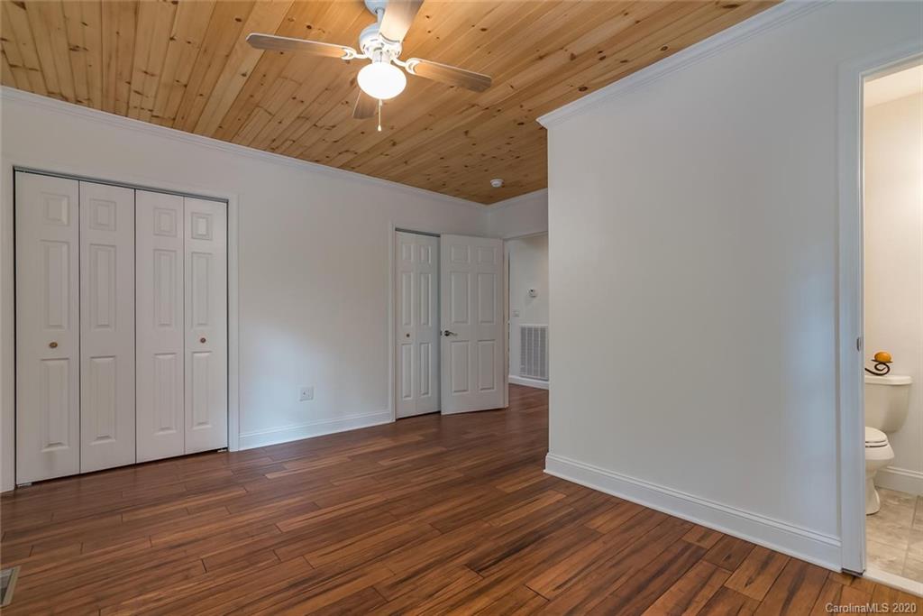 603 Vineyard Road Tryon, NC 28782 - Photo 23 of 39 a view of an empty room with wooden floor