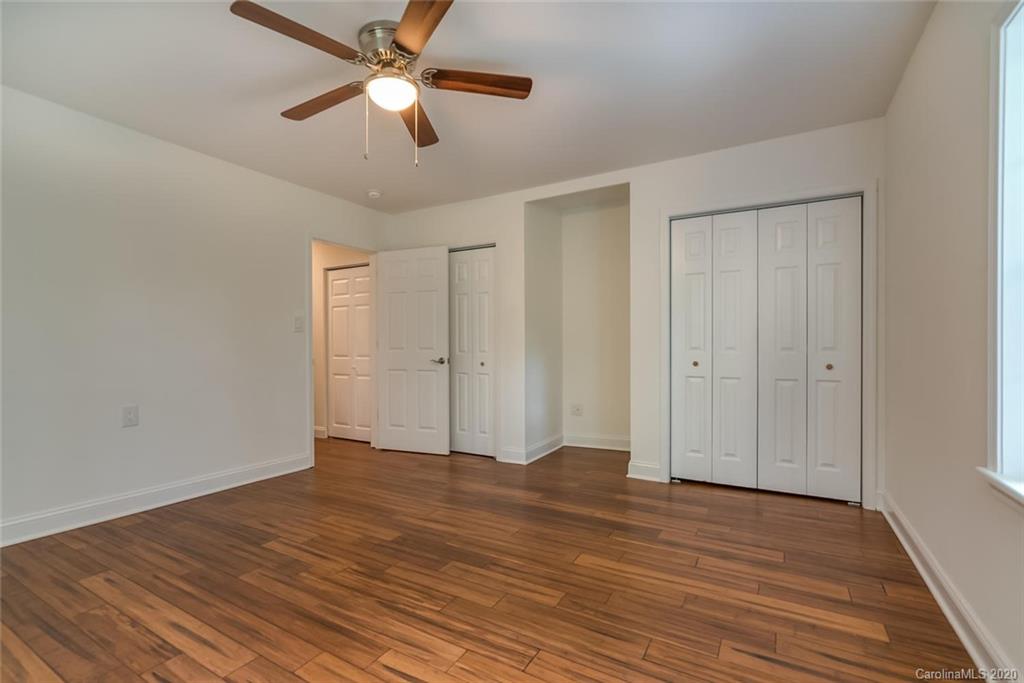 603 Vineyard Road Tryon, NC 28782 - Photo 27 of 39 a view of empty room with wooden floor