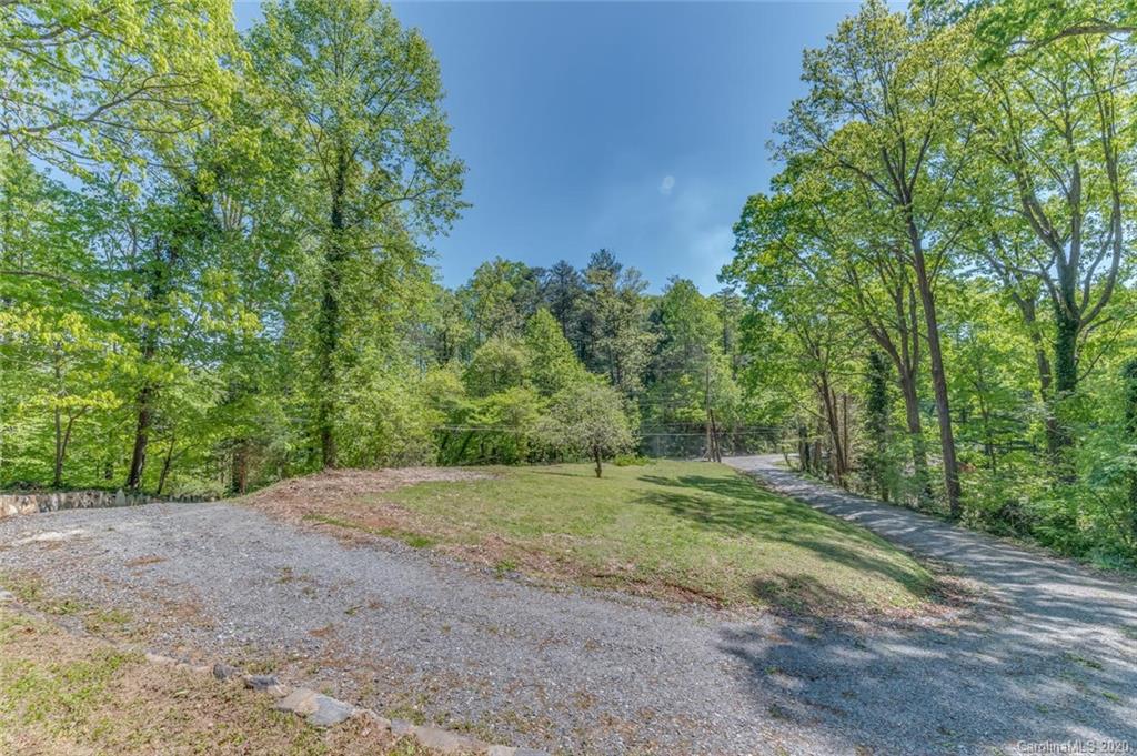 603 Vineyard Road Tryon, NC 28782 - Photo 31 of 39 a view of a dirt road with trees in the background